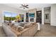 Cozy living room with fireplace, built-in shelving, and access to patio and pool at 37308 N 100Th Pl, Scottsdale, AZ 85262