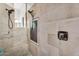 Shower stall with designer tile surround, river rock floor, and modern fixtures at 37308 N 100Th Pl, Scottsdale, AZ 85262