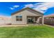 Rear view of home including covered patio. A low maintenance yard is also visible at 3907 E Archer Dr, San Tan Valley, AZ 85140