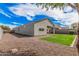This is the rear view of home with a patio and xeriscaped backyard for low maintenance living at 3907 E Archer Dr, San Tan Valley, AZ 85140