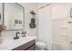 This bathroom features a well-lit vanity and a tiled wall, as well as a bathtub with shower at 3907 E Archer Dr, San Tan Valley, AZ 85140