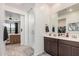 Bathroom with a walk-in shower, double vanity, and modern fixtures at 3907 E Archer Dr, San Tan Valley, AZ 85140