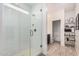 Bright bathroom featuring a glass-enclosed shower and well-organized shelving at 3907 E Archer Dr, San Tan Valley, AZ 85140