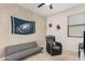 This bedroom showcases a versatile layout with a sofa and chair, perfect for relaxation or gaming at 3907 E Archer Dr, San Tan Valley, AZ 85140