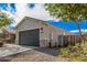 Well-kept front yard with drought-resistant landscaping, leading to a charming single-story home with a two-car garage at 3907 E Archer Dr, San Tan Valley, AZ 85140