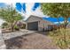 Well-kept front yard with drought-resistant landscaping, leading to a charming single-story home with a two-car garage at 3907 E Archer Dr, San Tan Valley, AZ 85140