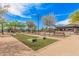 A beautiful park area with walking paths, horseshoe pit, shaded benches, and lush landscaping, perfect for neighborhood fun at 3907 E Archer Dr, San Tan Valley, AZ 85140