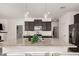 Modern kitchen island with granite countertops and stainless steel appliances at 3907 E Archer Dr, San Tan Valley, AZ 85140