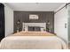 Warm main bedroom with decorative wall paneling and ambient lighting fixtures at 3907 E Archer Dr, San Tan Valley, AZ 85140