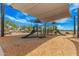 Community playground featuring modern equipment and protective wood chip ground cover at 3907 E Archer Dr, San Tan Valley, AZ 85140