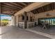 A stylish outdoor poolside bar with sleek barstools, modern lighting, and an inviting space for residents to relax at 3907 E Archer Dr, San Tan Valley, AZ 85140