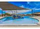 A fun community splash pad for , featuring interactive water features and shaded seating areas by the sparkling pool at 3907 E Archer Dr, San Tan Valley, AZ 85140