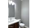 Powder bath featuring modern vanity with stylish countertop, faucet and lighting at 4056 E Devon Dr, Gilbert, AZ 85296