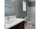 Bathroom with a granite sink, new toilet, and bathtub/shower at 4056 E Devon Dr, Gilbert, AZ 85296