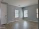 Bedroom with neutral walls, hard wood floors, and large windows at 4056 E Devon Dr, Gilbert, AZ 85296