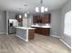 Spacious open kitchen featuring stainless steel appliances, ample countertops, and center island at 4056 E Devon Dr, Gilbert, AZ 85296