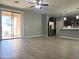 Bright and airy living room with wood floors open to kitchen and patio access at 4056 E Devon Dr, Gilbert, AZ 85296