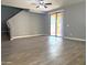 Spacious living room with sliding glass doors and stairs at 4056 E Devon Dr, Gilbert, AZ 85296