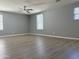 Open-concept living room boasting vinyl plank flooring and ample natural light at 4056 E Devon Dr, Gilbert, AZ 85296