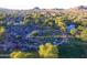 Aerial view of an outdoor concert in a park with a lake, showcasing a vibrant community gathering at 40741 N Citrus Canyon Trl, Anthem, AZ 85086