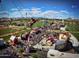 Vibrant aerial view of a carnival, showcasing rides, food stalls, and a lively atmosphere for community entertainment at 40741 N Citrus Canyon Trl, Anthem, AZ 85086