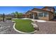 Large backyard showcasing low maintenance landscaping, artificial grass, and desert features at 40741 N Citrus Canyon Trl, Anthem, AZ 85086