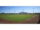 Well-maintained baseball field with manicured grass, clear skies, and mountain views offers a great community amenity at 40741 N Citrus Canyon Trl, Anthem, AZ 85086