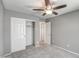 Neutral bedroom featuring carpet, ceiling fan, and closet at 40741 N Citrus Canyon Trl, Anthem, AZ 85086