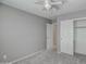Neutral bedroom featuring carpet, ceiling fan, and closet at 40741 N Citrus Canyon Trl, Anthem, AZ 85086