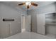 Bright bedroom with neutral paint, vinyl flooring, closet and view into another room at 40741 N Citrus Canyon Trl, Anthem, AZ 85086