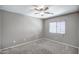 Neutral bedroom featuring carpet, ceiling fan, and blinds at 40741 N Citrus Canyon Trl, Anthem, AZ 85086