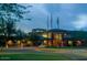 Stunning exterior view of community building at dusk, showcasing its modern design at 40741 N Citrus Canyon Trl, Anthem, AZ 85086
