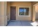 Close up of the front entrance with a decorative door and window at 40741 N Citrus Canyon Trl, Anthem, AZ 85086