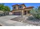 Charming two-story home with low maintenance desert landscaping and extended driveway at 40741 N Citrus Canyon Trl, Anthem, AZ 85086