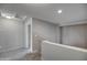 A spacious upstairs hallway with carpet flooring, recessed lighting, and neutral colored walls at 40741 N Citrus Canyon Trl, Anthem, AZ 85086