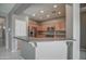 Beautiful open kitchen with breakfast bar, stainless appliances, and light wood cabinetry at 40741 N Citrus Canyon Trl, Anthem, AZ 85086