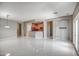 Open-concept living room boasts white tile floors, neutral walls, and ample space for entertaining at 40741 N Citrus Canyon Trl, Anthem, AZ 85086