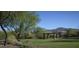 Serene park featuring a covered picnic area, lush greenery, and mountain views for outdoor enjoyment at 40741 N Citrus Canyon Trl, Anthem, AZ 85086