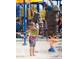 Vibrant splash pad with interactive features perfect for Gathering fun and cooling off on hot days at 40741 N Citrus Canyon Trl, Anthem, AZ 85086