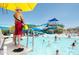 Busy community pool with lifeguard, slides, and plenty of swimmers at 40741 N Citrus Canyon Trl, Anthem, AZ 85086