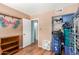 Spare bedroom featuring a bookshelf, fan, and closet storage at 4218 S 46Th Pl, Phoenix, AZ 85040