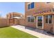 Home exterior featuring a private gated patio, artificial turf, and convenient front door parking at 4218 S 46Th Pl, Phoenix, AZ 85040
