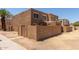 Two-story home with textured stucco exterior and a small walled front yard at 4218 S 46Th Pl, Phoenix, AZ 85040
