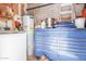 Garage interior showcasing a washing machine, tool chest, and water heater at 4218 S 46Th Pl, Phoenix, AZ 85040
