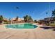 Community pool surrounded by fencing and buildings, offering a refreshing amenity at 4218 S 46Th Pl, Phoenix, AZ 85040