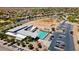 Aerial view showcases a community center with pool, parking, and green spaces at 5094 E Umber Rd, San Tan Valley, AZ 85143