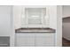 Granite vanity with double sinks and chrome fixtures are featured in bathroom at 5094 E Umber Rd, San Tan Valley, AZ 85143