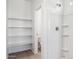 Bright bathroom showcases walk-in shower, open shelving, and adjacent toilet room at 5094 E Umber Rd, San Tan Valley, AZ 85143