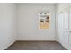 A bright bedroom features neutral carpet and a window at 5094 E Umber Rd, San Tan Valley, AZ 85143