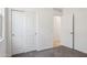 A bright bedroom features neutral carpet, a window, and large closet at 5094 E Umber Rd, San Tan Valley, AZ 85143